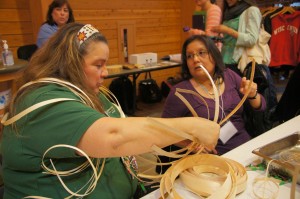 Judy demonstrates how to make the basket's base.