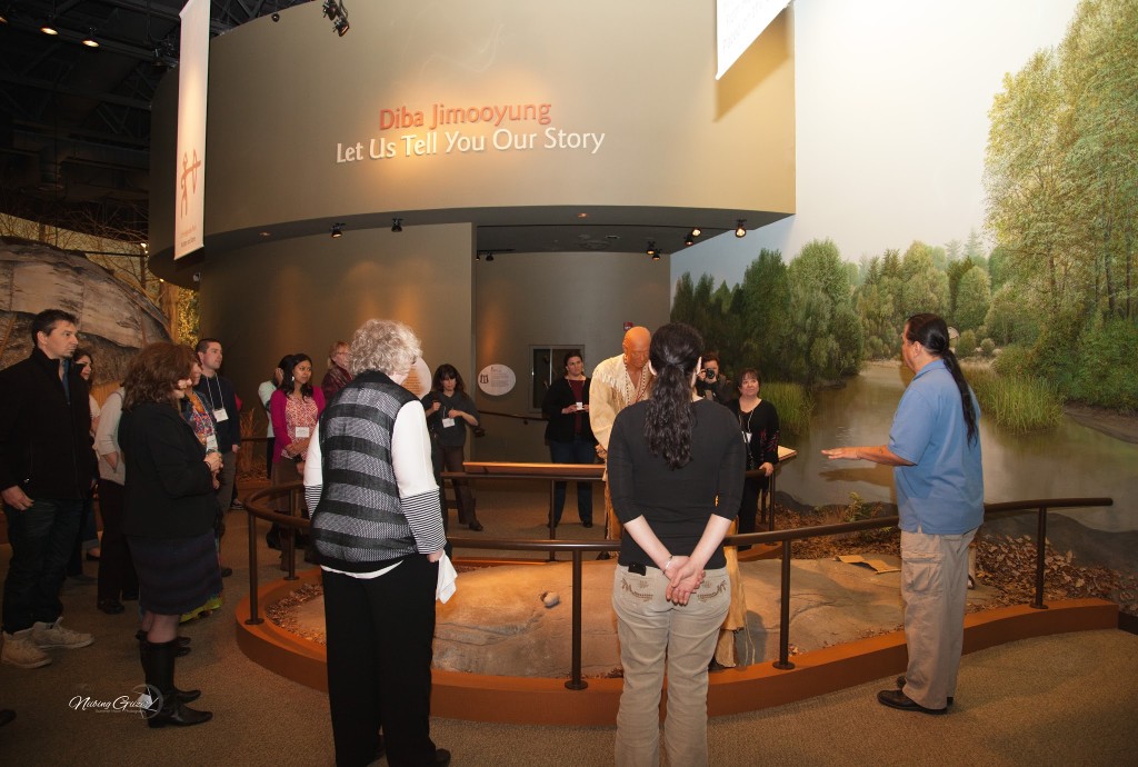 Raymond Cadotte leads a tour of the exhibit