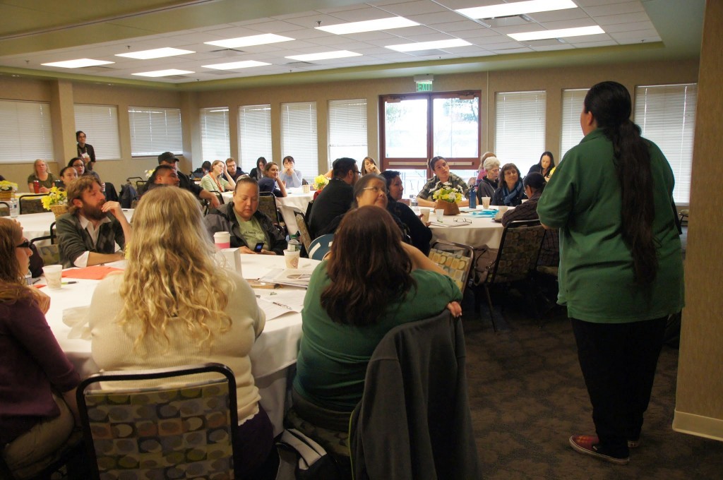 Shannon explains the value of strategic planning to the group, and lays out directions for the first task: discuss in groups and write on post-it notes any out-of-the-box ideas that CGLCK could accomplish