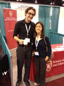 Omar and Cat in front of our SLIS booth