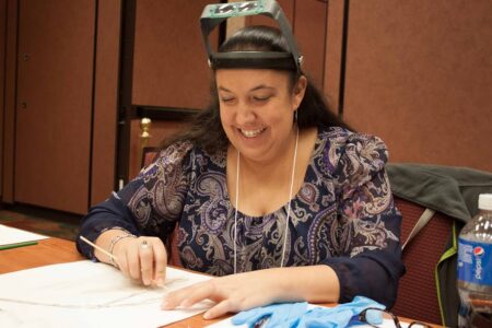 Renata cleaning beadwork