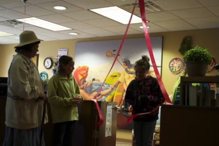 No More Red Tape: Nancy summons a community elder and two youths for the ribbon cutting.